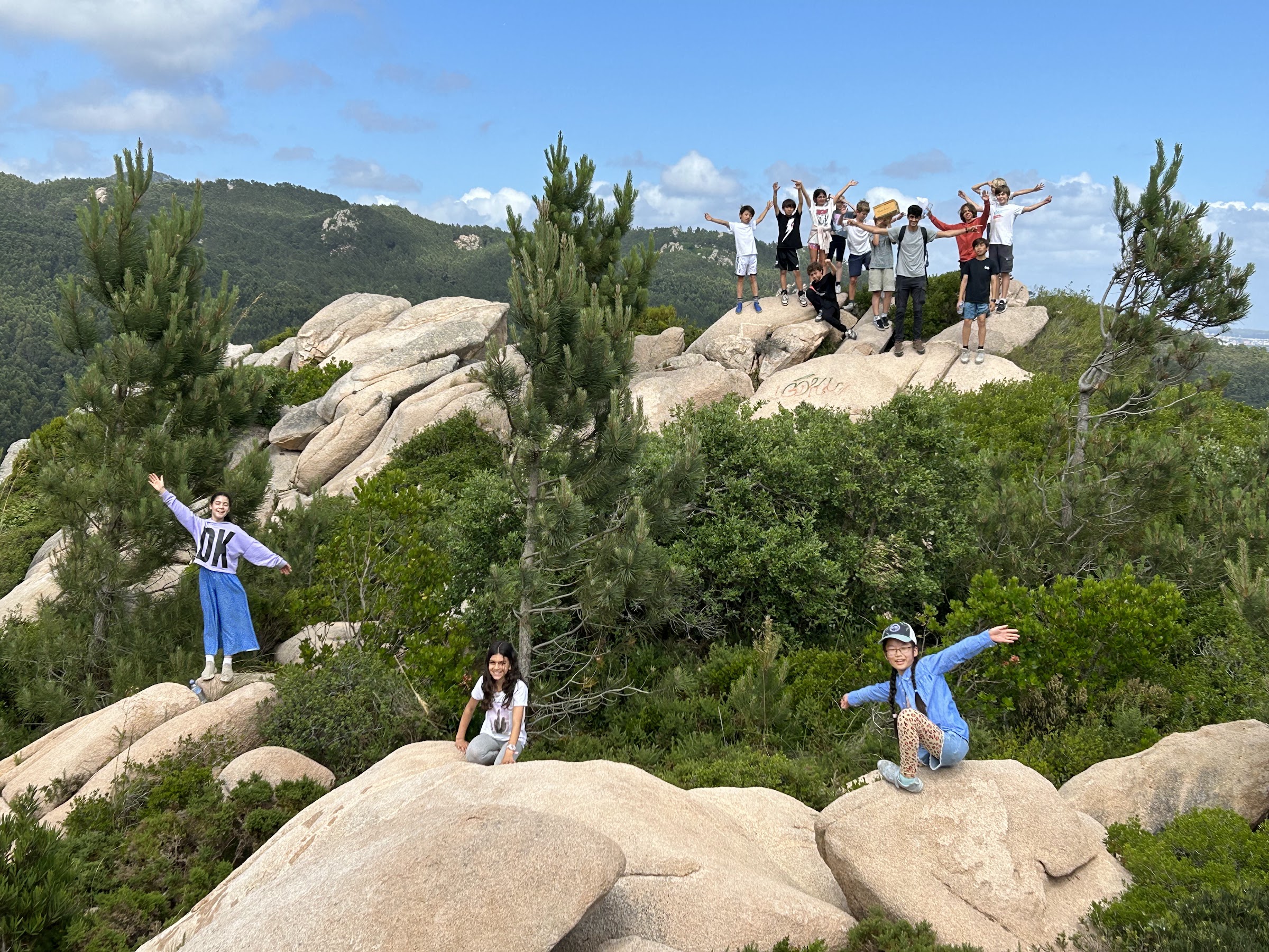Birthday group celebrating on granite boulders in the Sintra hills