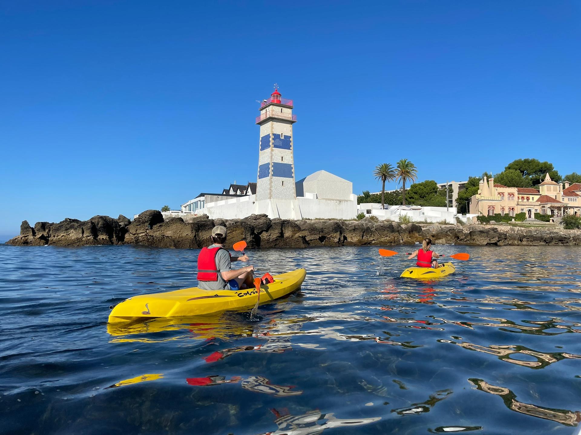 Kayakers paddling near the Cascais lighthouse